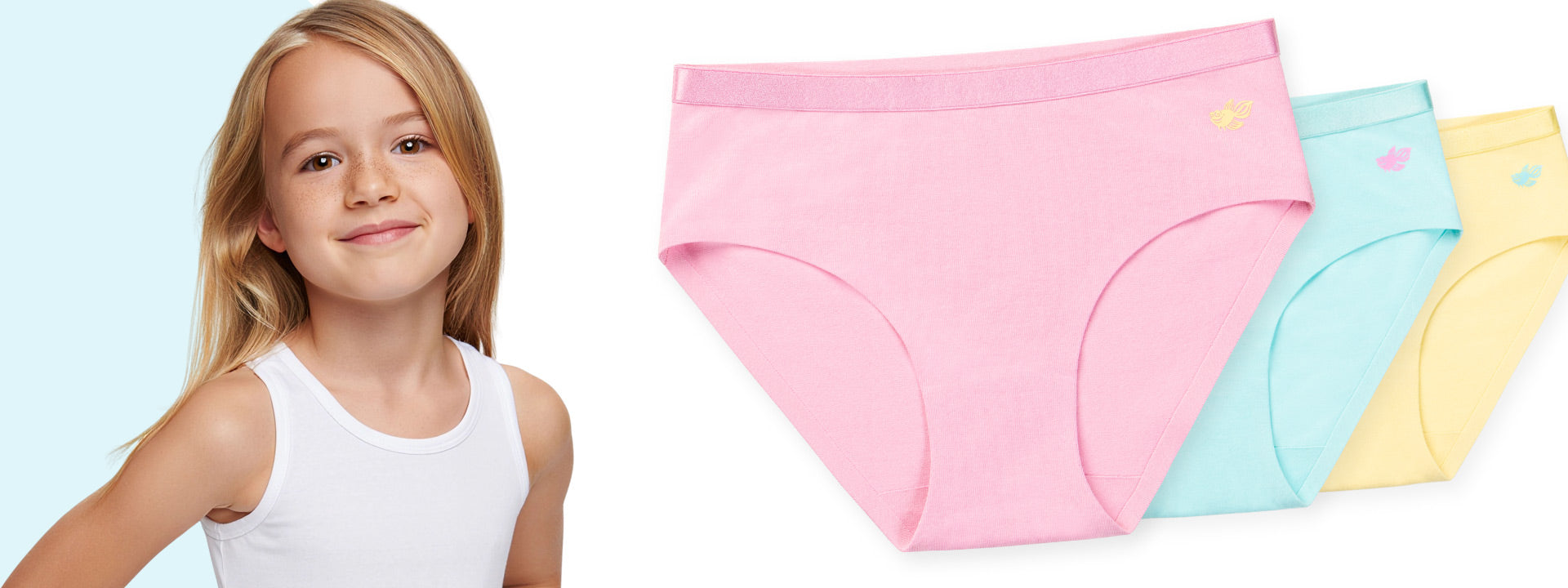 Child wearing a white tank top next to three pairs of colorful bella brief girls underwear on a light blue background