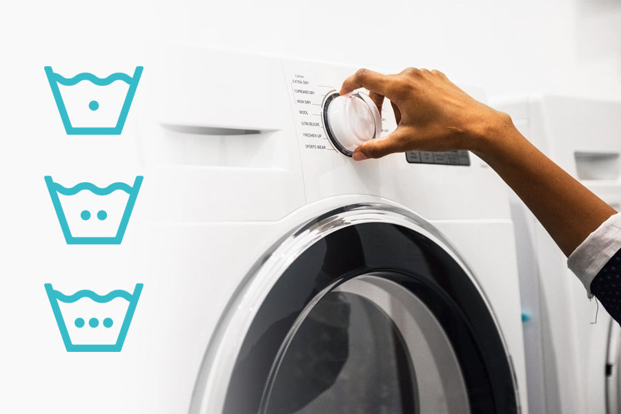 washing machine being dialed in with hot and cold laundry icons