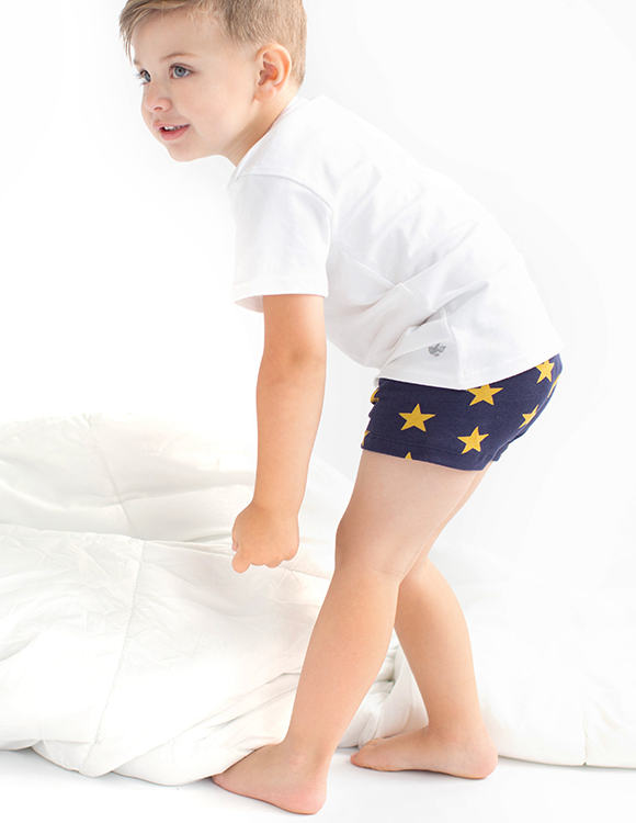 boy wearing white t-shirt and blue boxer briefs