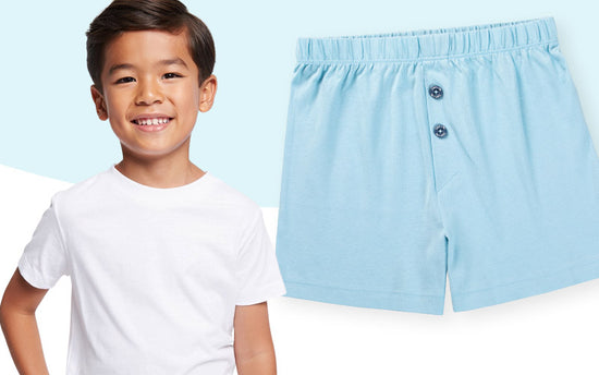 Boy wearing Noah cotton boxers with a white Logan cotton t-shirt. 