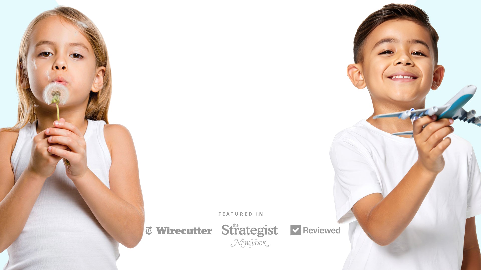 Two children, one blowing a dandelion and the other holding a toy airplane, on a white background.