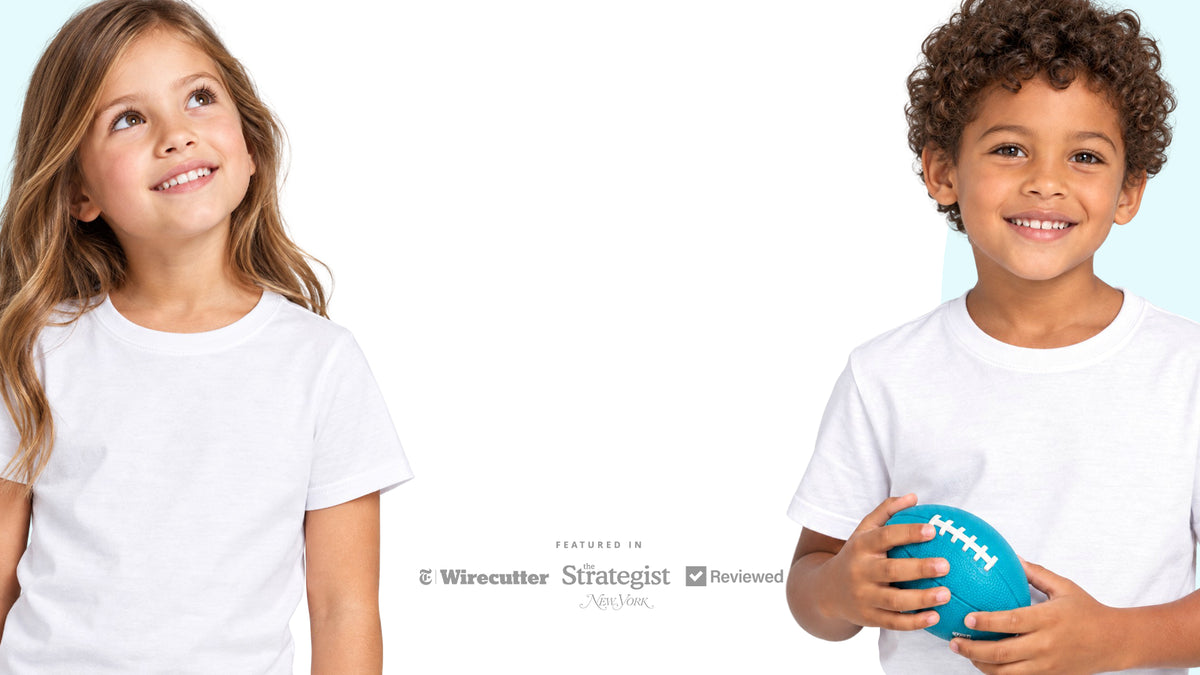 a young girl and young boy wearing white t-shirts