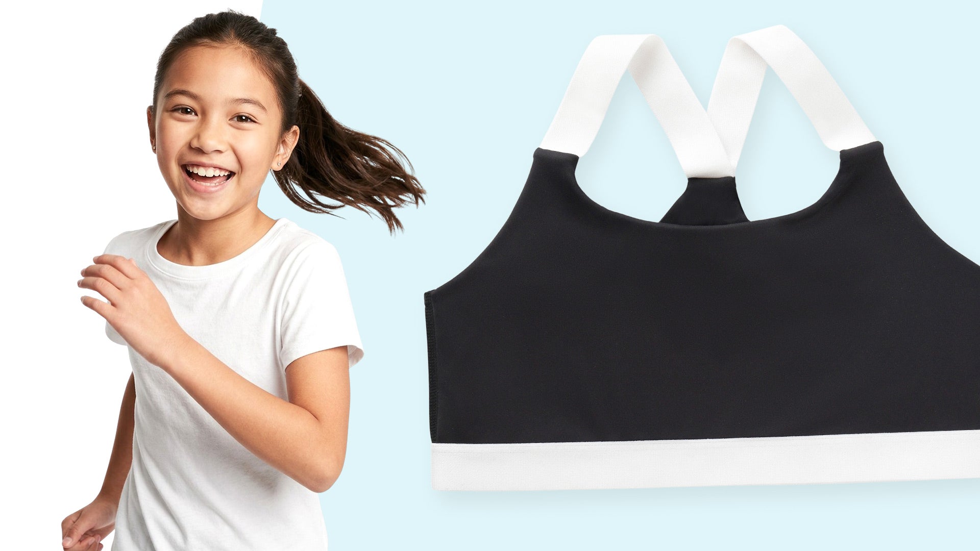 A black sports bra with white shoulder straps and a white underband, shown next to a smiling young girl wearing a white t-shirt against a light blue background.